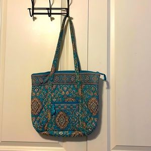 Vera Bradley zip top tote with 6 inner pockets and small front zip pocket.